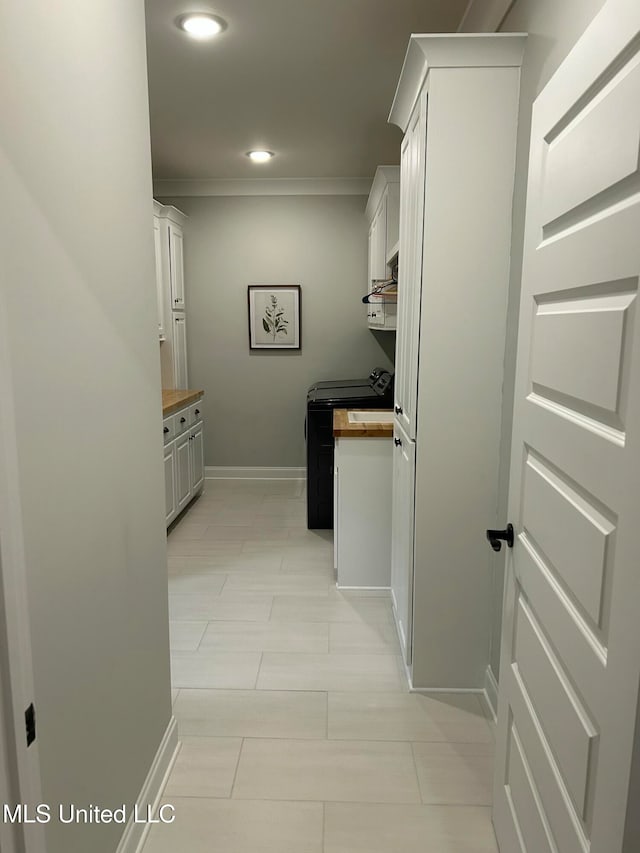 laundry room with crown molding