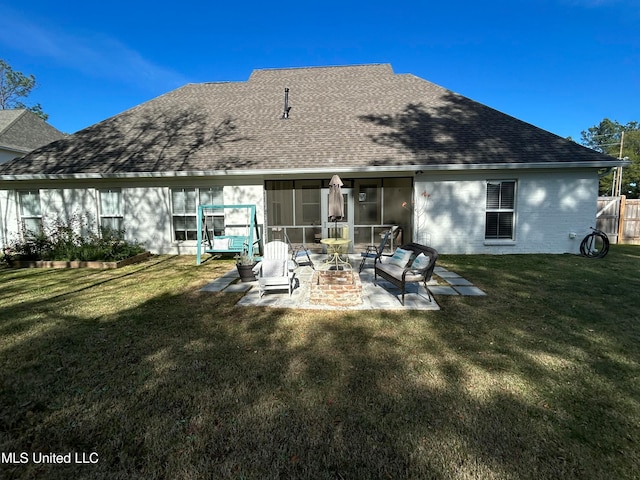 back of house with a patio, a sunroom, and a yard