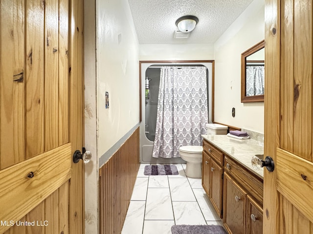 full bathroom with toilet, vanity, a textured ceiling, and shower / bathtub combination with curtain