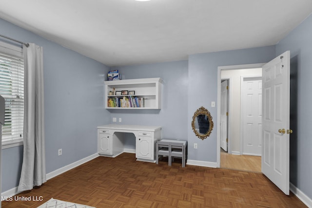 interior space featuring baseboards