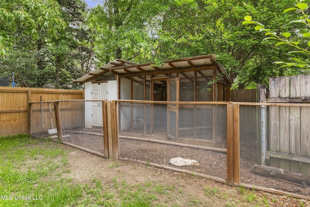 view of poultry coop featuring a fenced backyard
