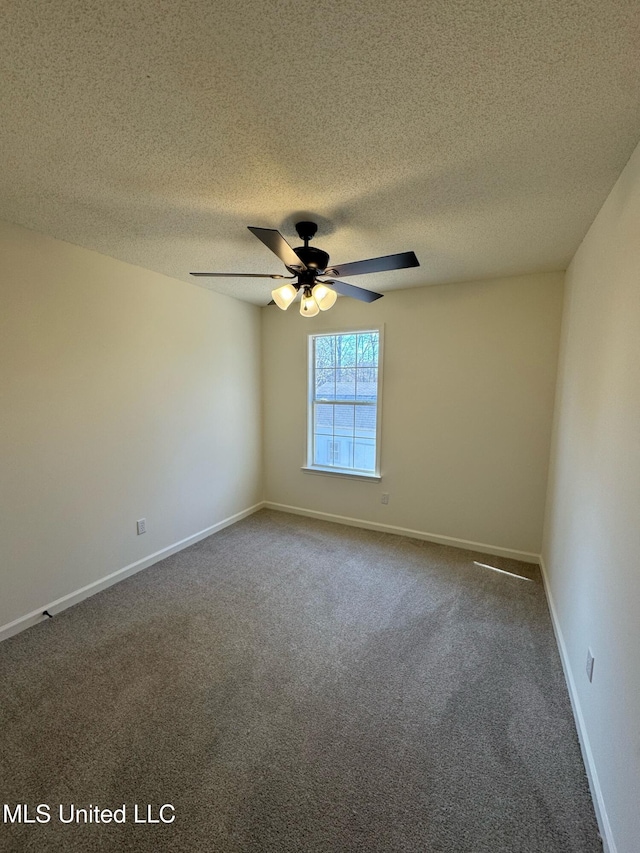 unfurnished room with carpet, ceiling fan, and a textured ceiling