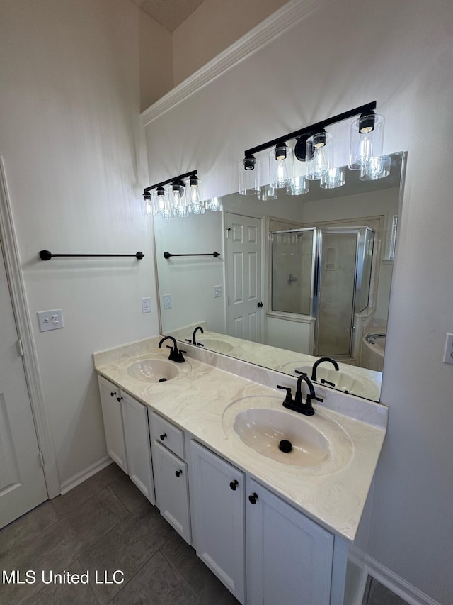 bathroom with vanity, tile patterned floors, and a shower with door