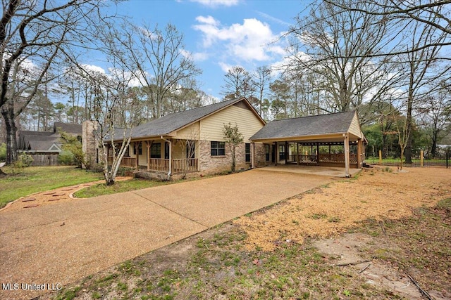 view of front of house featuring a carport and a porch