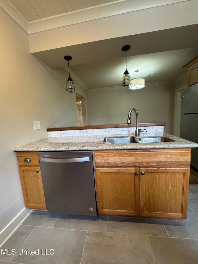 kitchen with stainless steel appliances, light stone countertops, sink, and decorative light fixtures