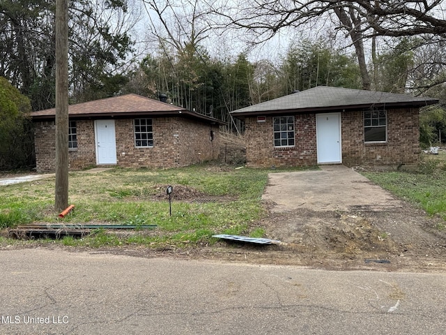 single story home with brick siding