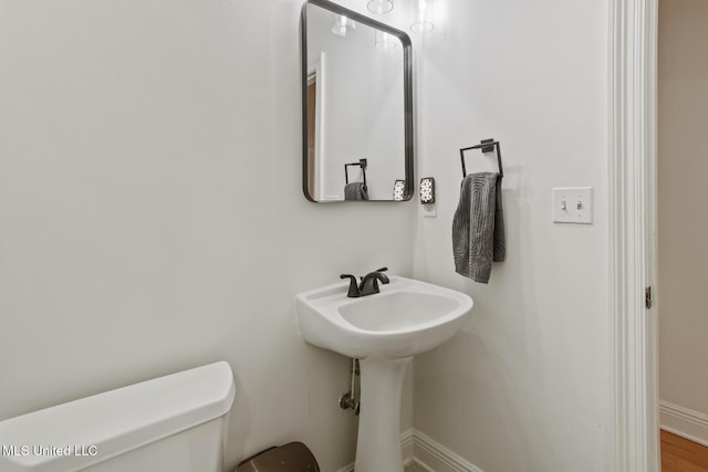 bathroom with toilet and sink