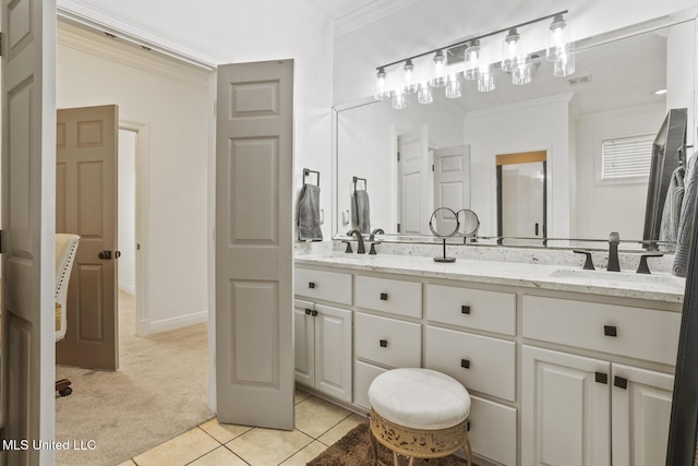 bathroom featuring crown molding, tile patterned floors, and vanity