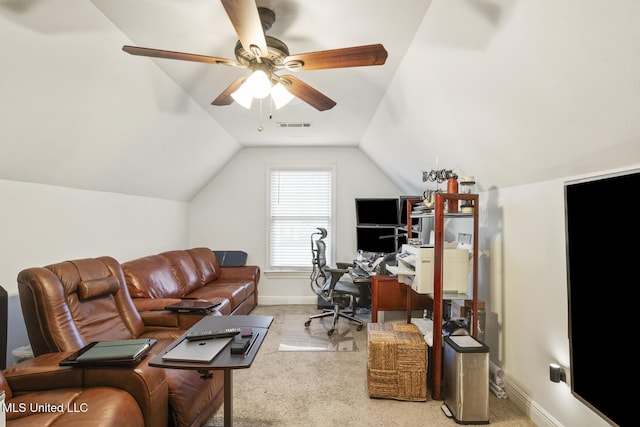 office featuring light carpet, vaulted ceiling, and ceiling fan