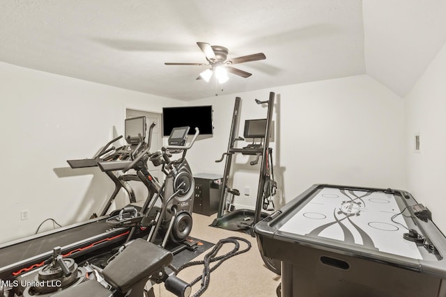 workout area featuring lofted ceiling, carpet floors, and ceiling fan