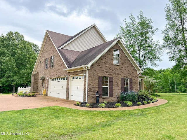 view of front of house with a shingled roof, an attached garage, a front lawn, brick siding, and driveway