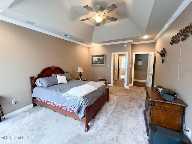 bedroom featuring visible vents, crown molding, light carpet, baseboards, and a raised ceiling