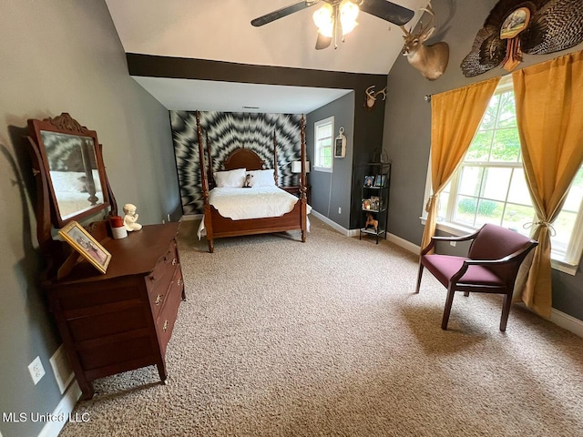 carpeted bedroom featuring a ceiling fan, baseboards, and vaulted ceiling