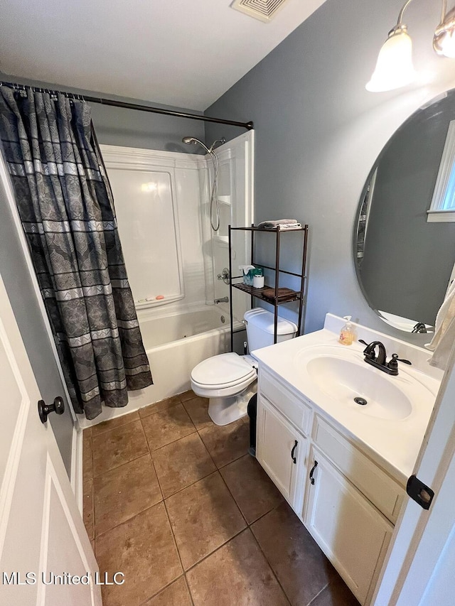 full bath featuring vanity, toilet, tile patterned floors, and shower / tub combo