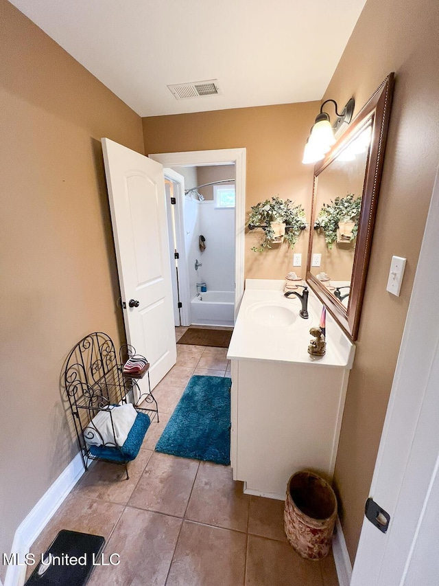 bathroom with shower / tub combination, vanity, tile patterned floors, baseboards, and visible vents