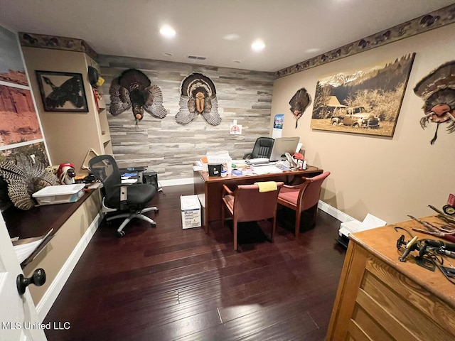 home office featuring visible vents, wooden walls, an accent wall, recessed lighting, and hardwood / wood-style floors