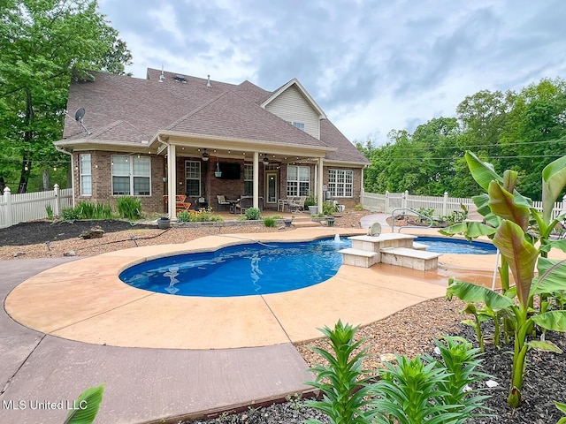 view of swimming pool with a fenced in pool, a ceiling fan, a fenced backyard, and a patio area