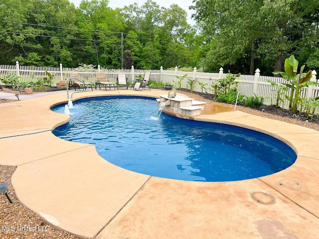 view of swimming pool with a patio, fence private yard, and a fenced in pool