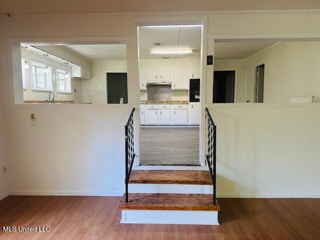 1561 Section Line Rd, Picayune, MS 39466 - stairs with wood finished floors, baseboards, and ornamental molding