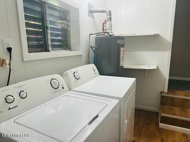 1561 Section Line Rd, Picayune, MS 39466 - washroom with washing machine and clothes dryer, wood finished floors, water heater, and baseboards