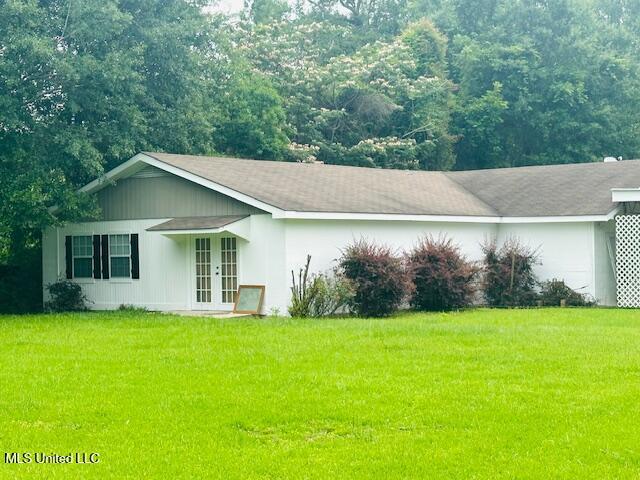 1561 Section Line Rd, Picayune, MS 39466 - view of side of property featuring french doors and a lawn