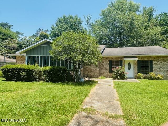 1561 Section Line Rd, Picayune, MS 39466 - view of front of home with brick siding and a front yard