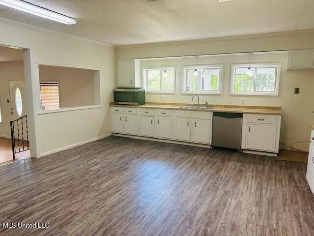 1561 Section Line Rd, Picayune, MS 39466 - kitchen featuring stainless steel appliances, a sink, ornamental molding, dark wood-style flooring, and white cabinetry