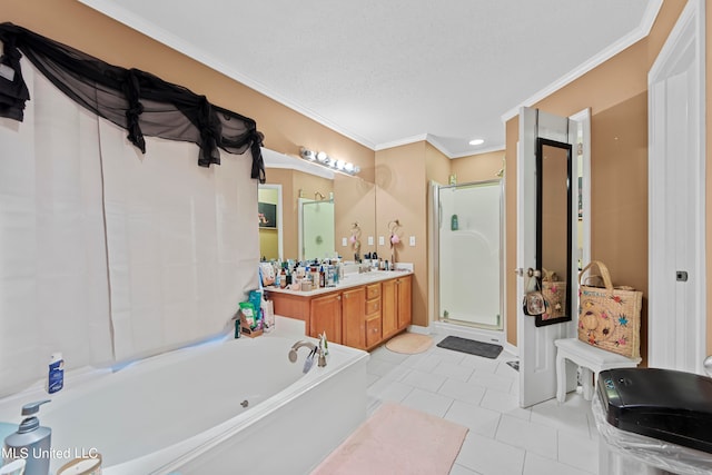 bathroom with tile patterned floors, separate shower and tub, ornamental molding, vanity, and a textured ceiling