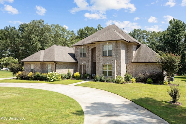 french country home with a front yard