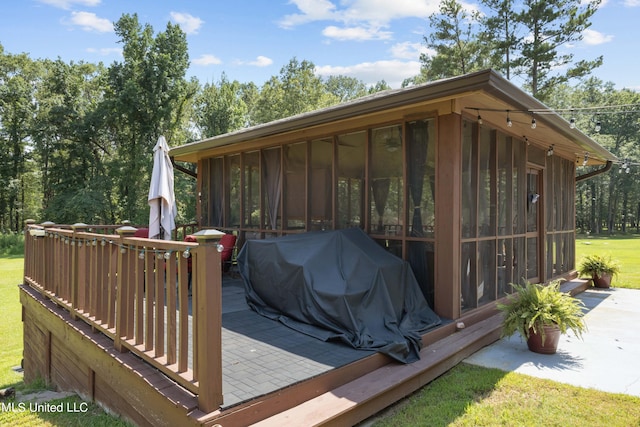 wooden terrace with a sunroom