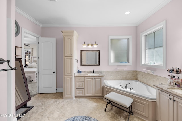 bathroom with a bathtub, tile patterned floors, ornamental molding, and vanity