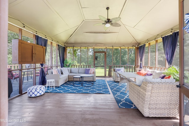 exterior space with ceiling fan, vaulted ceiling, and plenty of natural light