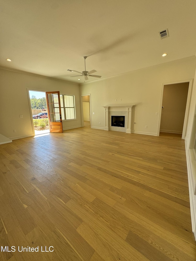412 Butternut Dr Unit 184, Canton, MS 39046 - unfurnished living room featuring light wood-type flooring, a fireplace, ceiling fan, baseboards, and recessed lighting