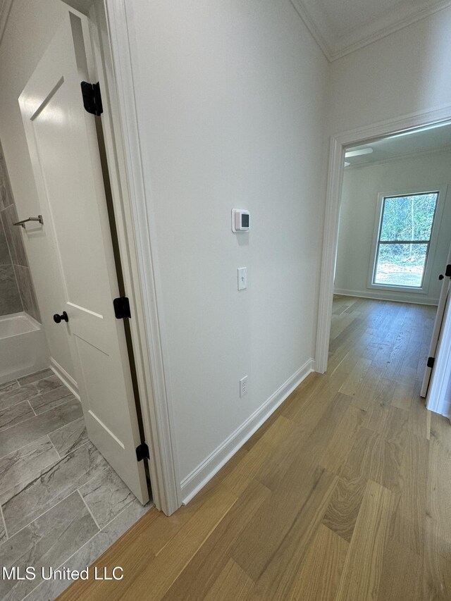 412 Butternut Dr Unit 184, Canton, MS 39046 - hallway featuring crown molding, baseboards, and light wood-style floors