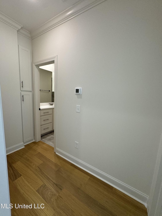 412 Butternut Dr Unit 184, Canton, MS 39046 - hall featuring crown molding, dark wood-style flooring, and baseboards