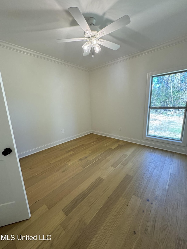 412 Butternut Dr Unit 184, Canton, MS 39046 - unfurnished room with crown molding, baseboards, wood finished floors, and ceiling fan