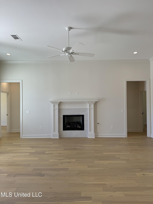 412 Butternut Dr Unit 184, Canton, MS 39046 - unfurnished living room featuring a ceiling fan, baseboards, a tiled fireplace, light wood-style floors, and recessed lighting