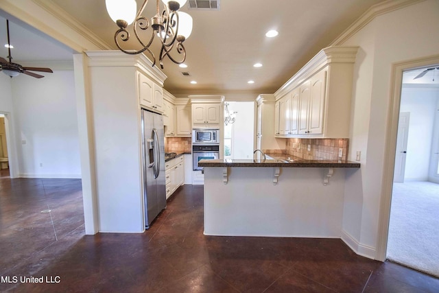 kitchen featuring kitchen peninsula, a breakfast bar area, stainless steel appliances, crown molding, and decorative light fixtures