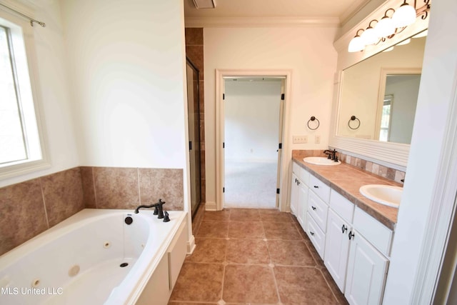 bathroom featuring vanity, ornamental molding, tile patterned flooring, and plus walk in shower