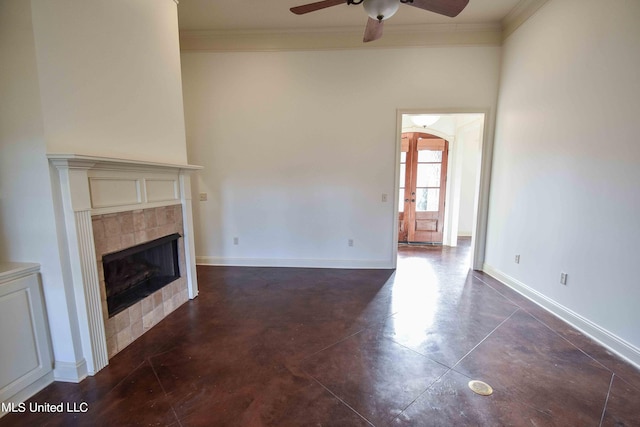 unfurnished living room featuring crown molding, a tile fireplace, and ceiling fan