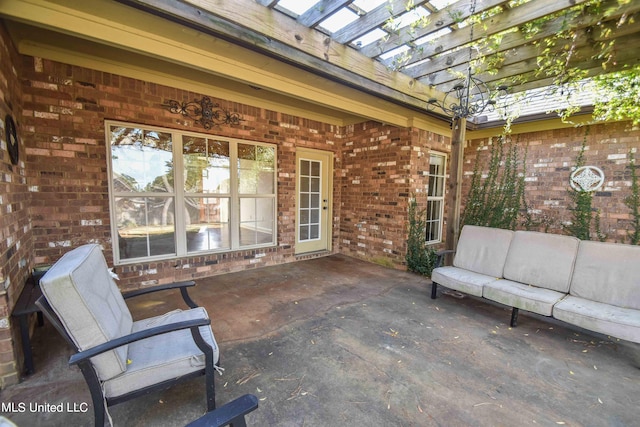 view of patio with outdoor lounge area and a pergola