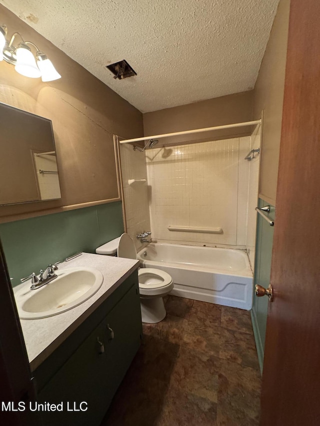 704 Oak Ave, Ruleville, MS 38771 - full bath with a textured ceiling, toilet, vanity, and shower / bathtub combination