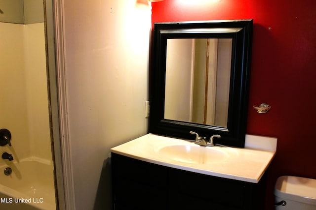 full bathroom featuring vanity,  shower combination, and toilet