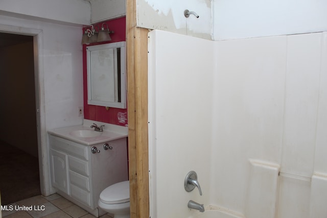 full bathroom with tile patterned flooring, vanity, toilet, and washtub / shower combination