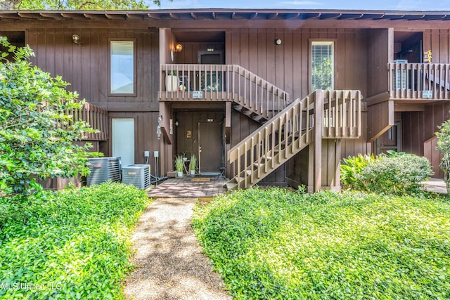 214 Molokai Unit D, Diamondhead, MS 39525 - exterior space featuring stairway and cooling unit