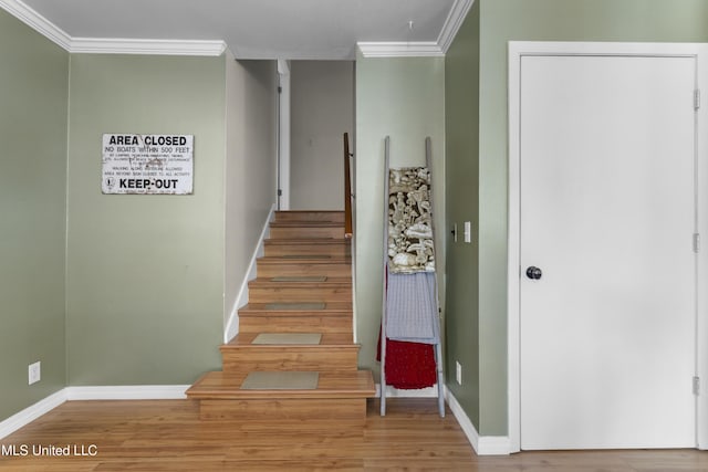 4620 Holly Heath Dr, Gautier, MS 39553 - stairway with crown molding, baseboards, and wood finished floors