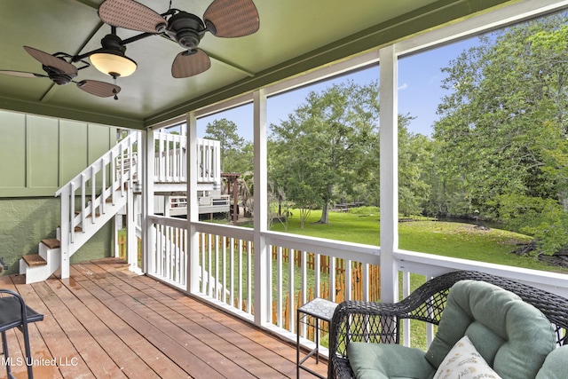 4620 Holly Heath Dr, Gautier, MS 39553 - sunroom / solarium featuring ceiling fan and view of wooded area