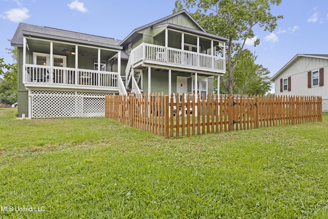 4620 Holly Heath Dr, Gautier, MS 39553 - rear view of property featuring a sunroom, ceiling fan, a shingled roof, and board and batten siding