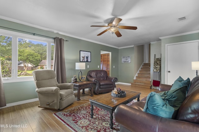 4620 Holly Heath Dr, Gautier, MS 39553 - living area with a ceiling fan, baseboards, wood finished floors, crown molding, and stairs