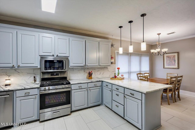 138 Oak Ridge Cir, Madison, MS 39110 - kitchen with stainless steel appliances, gray cabinetry, a chandelier, a peninsula, and crown molding